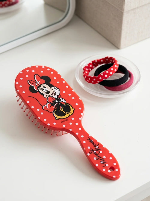 Brosse à Cheveux Démêlante Minnie Mouse Rouge mis en scène dans un décor du quotidien