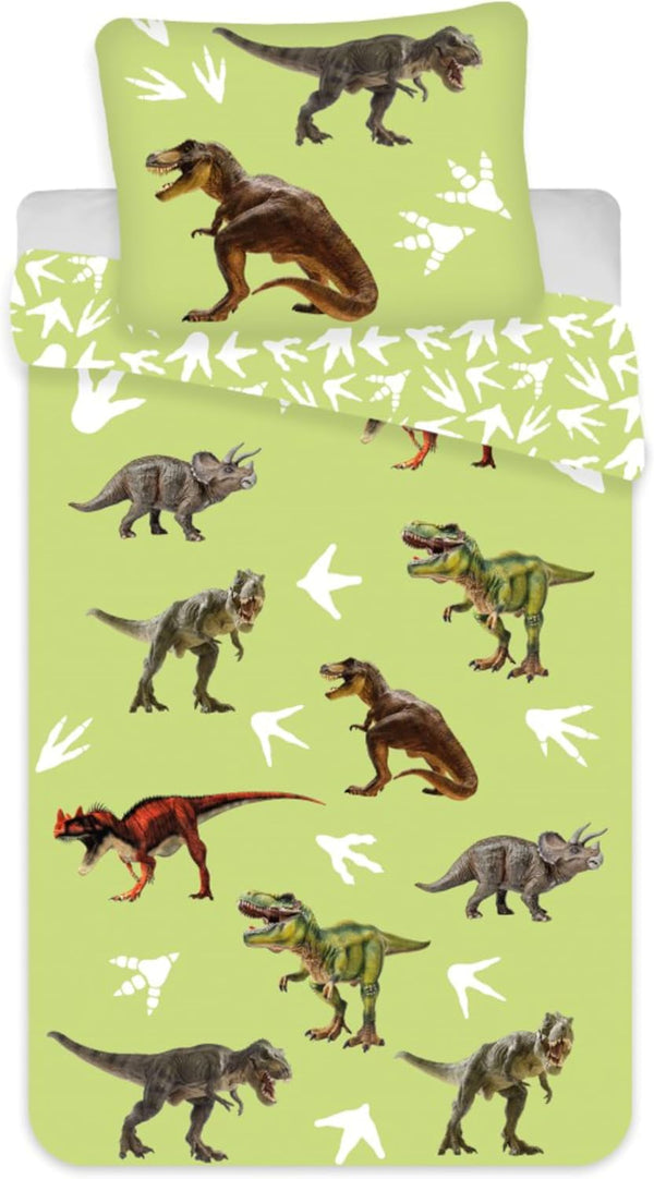 Parure de lit bébé verte avec dinosaures, housse de couette et taie assortie sur lit junior