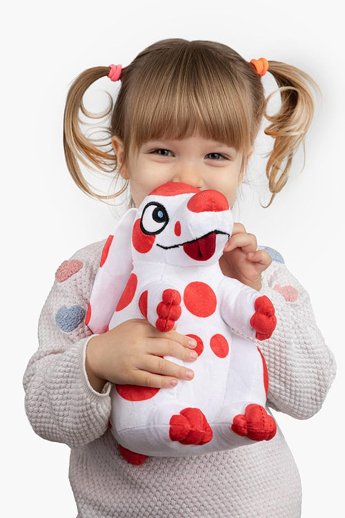 Détail des pois rouges et de la texture douce de la peluche Pimpa