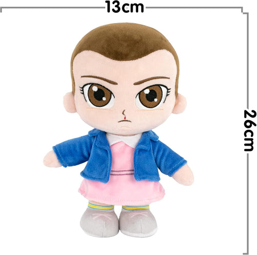 Peluche Mike Stranger Things 26 cm posée sur un lit, prête pour les câlins