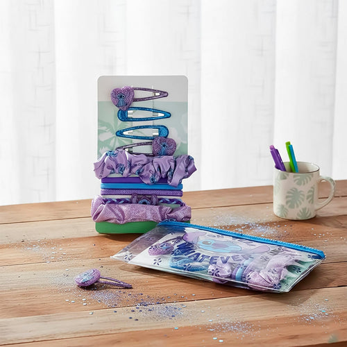 Accessoires cheveux Stitch bleu violet présentés sur leur support cartonné